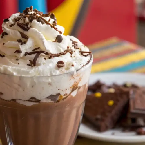A beautifully served frozen hot chocolate with toppings.